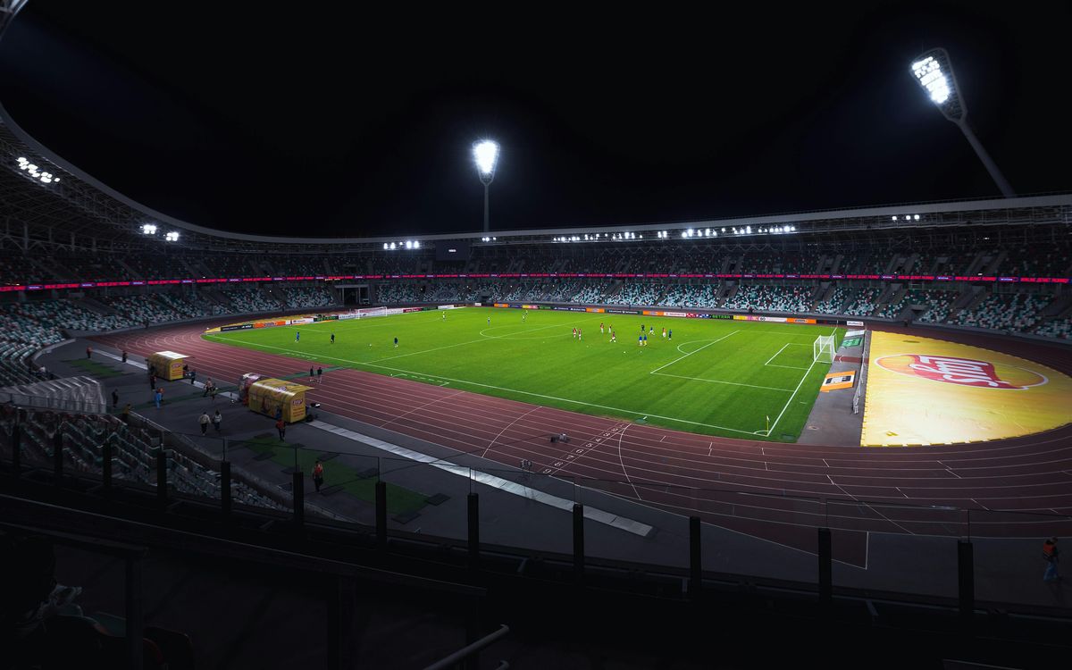An empty football stadium illuminated at night