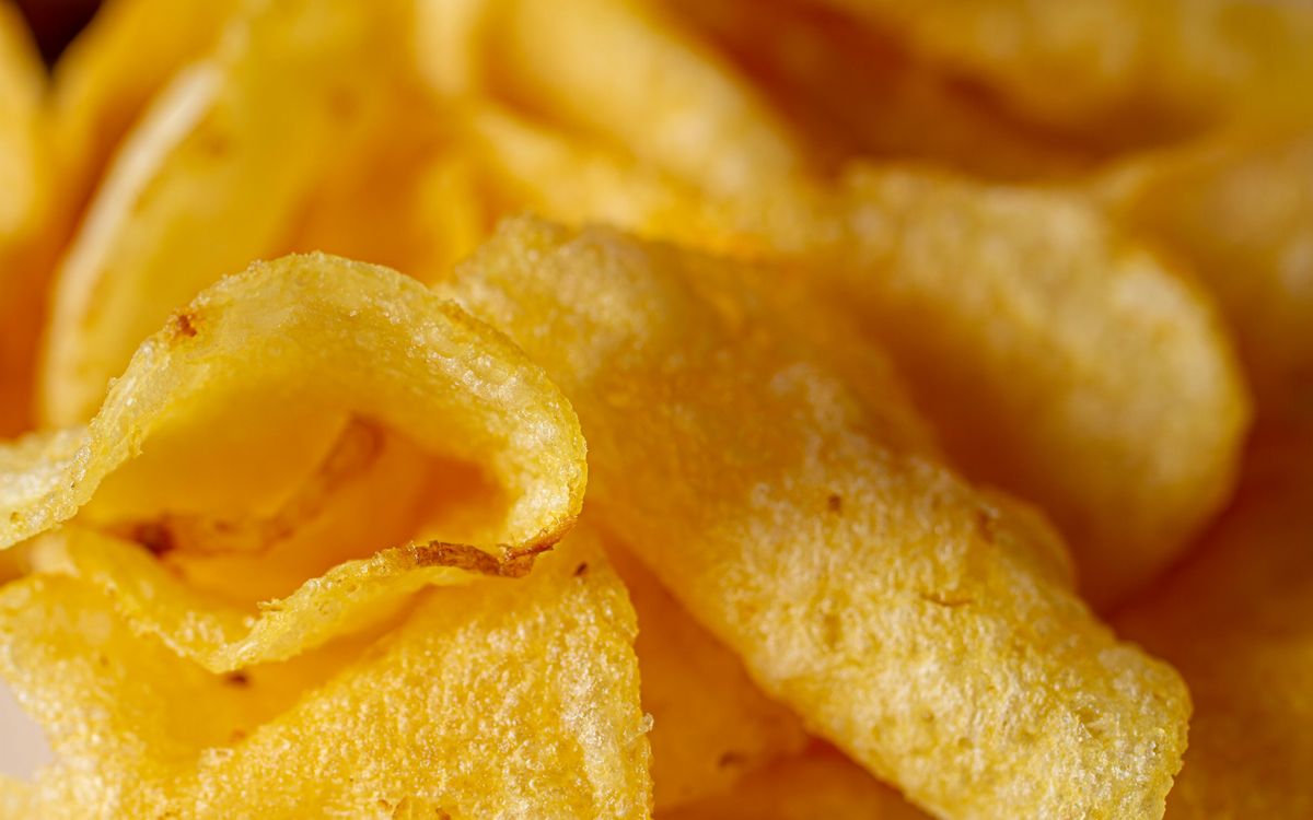 A close-up of crisp salted potato chips